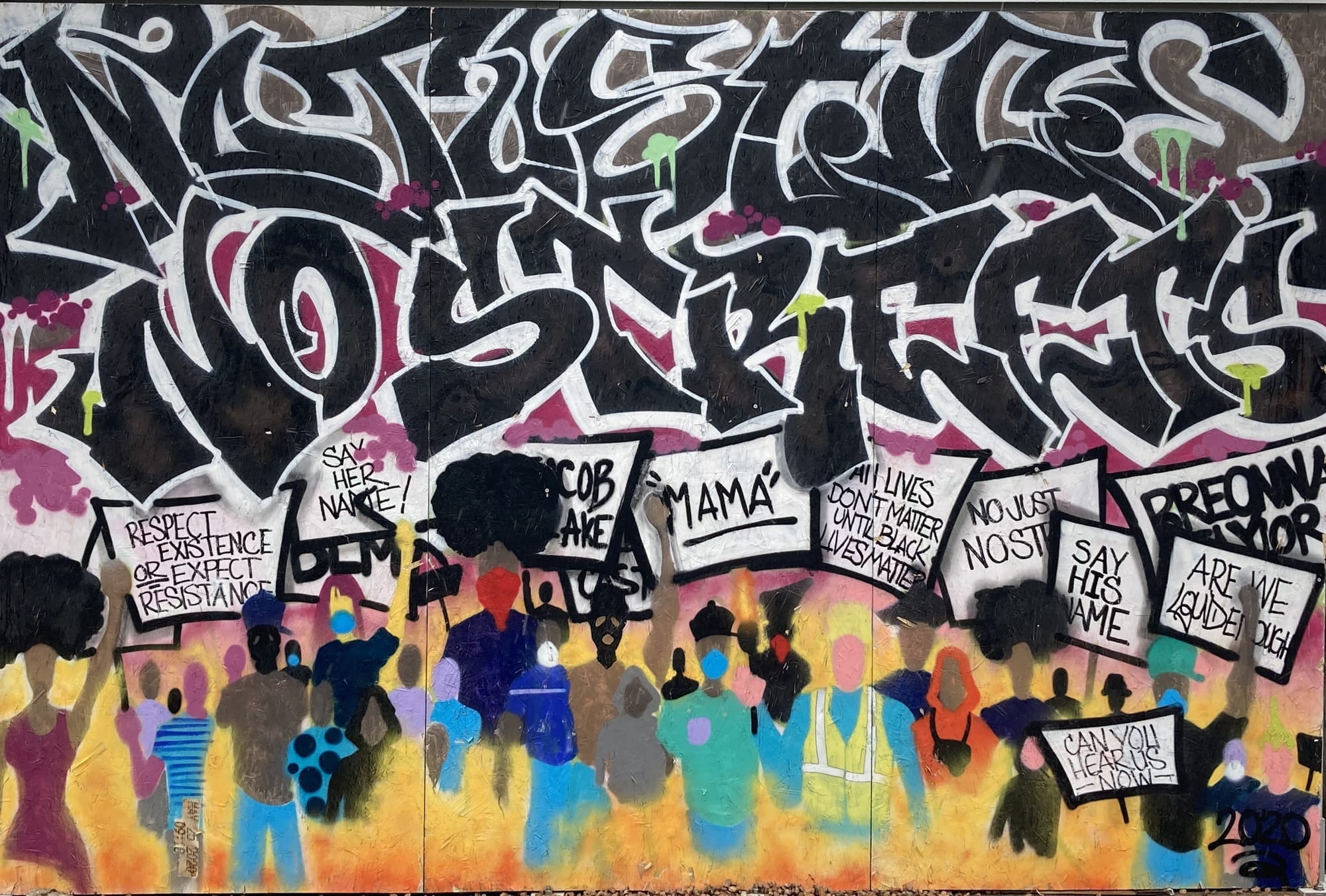 A street mural. "No Justice, No Streets" is painted in stylized script on the top half of the mural above depictions of people carrying protest signs.